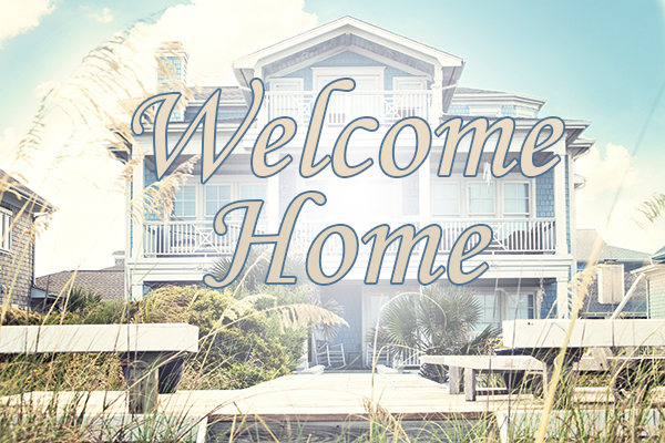 Home Builder Ocean County, Beach home with blue exterior with text "Welcome Home" superimposed