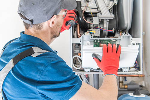 Furnace repair Manasquan technician at work